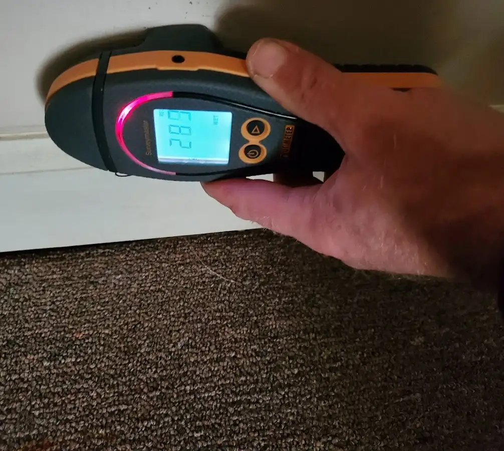 Moisture detection at baseboard during Storm Damage Restoration in Southbridge Town